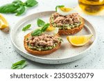 sandwiches with canned tuna, boiled egg and avocado. Food recipe background. Close up.