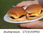 Hamburger Sandwich Between Perfectly Laid Buns With Cheese And Ketsup.