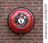 Small photo of Geldrop, the Netherlands - February 17, 2019: Automatic Defibrillator mounted on a wall for use by public in case of cardiac arrest.