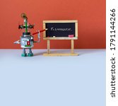 Small photo of Robot professor explains Pi mathematical constant irrational number 3.14. Funny robotic teacher with red pencil, black chalkboard handwritten formula. Red wall gray floor classroom. Copy space.