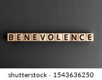 Small photo of Benevolence - word from wooden blocks with letters, being kind and helpful benevolence concept, top view on grey background