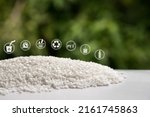 Small photo of White Pet Chips Semi Dull,PET chips recycle,PET polyester chips with blurred green background.Recycle icon, sustainable icon and Bottle icon. Chemical concept