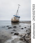 Small photo of Compelling photo captures the shipwreck at Helgenaes, Denmark. Weathered remains of maritime history against the rugged coastline, narrating tales of the sea's untamed power and maritime legacy.
