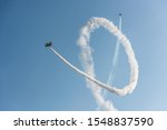 Airplanes on airshow. Aerobatic team performs flight at air show
