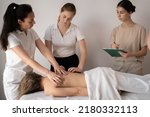Small photo of Massage training class, teacher teaches students to become a masseuse, health wellness massage training