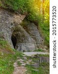 Small photo of Helme caves on a sunny summer day. Located in the manor park of the same name, the Helme caves, are an unrivalled sight in Estonia. Selective focus.