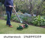 Old lawnmower being used in the ...