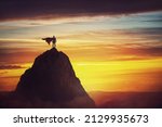 Small photo of Businessman superhero conceptual scene. Determined hero with red cape stands brave on a mountain peak. Business leadership, ambition and strength metaphor. Overcome obstacles and achieve success