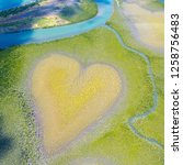 Small photo of Heart of Voh, aerial view, formation of mangroves vegetation resembles a heart seen from above, New Caledonia, Melanesia, South Pacific Ocean. Heart of Earth. Earth day. Love life, save environment.