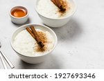 Small photo of Condensed milk rice pudding in bowls. Space for text.