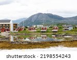 Small photo of Traditional red wooden house at Sommaroy (Sommaroy) island, Troms og Finnmark, North Norway