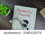 Small photo of Concept of Different Diagnosis write on a book isolated on Wooden Table. Selective focus on differential diagnosis text