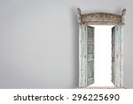 Grey retro style wooden door on gery cement wall background