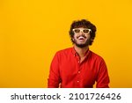 Small photo of Positive bearded man laughing out loud, chuckling and hysterically laughing with anecdote, having fun. Indoor studio shot isolated on orange background