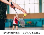 Badminton court with players. Tennis player with a racket. Badminton activity. Sports game of success. Happy kid playing badminton. The child beats the shuttle with a racket.