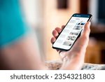 News online. Mobile phone screen. Senior woman reading newspaper on web portal and website. Latest daily information. Headlines on internet. Old person with smartphone. Misinformation, disinformation.
