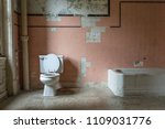 Pink Tile And Toilet In An...