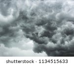 Small photo of Cloudy dramatic dark gray strormy sky. oncept of danger presentiment