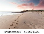 Beach Footprints Leading Into A ...