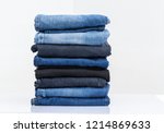 
Jeans trousers stack on white background