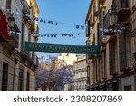 Small photo of MALAGA, SPAIN - MAY 20, 2023: Walking on Madre de Dios street (calle Madre de Dios) in Malaga, Spain on May 20, 2023