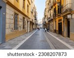 Small photo of MALAGA, SPAIN - MAY 20, 2023: Walking on Madre de Dios street (calle Madre de Dios) in Malaga, Spain on May 20, 2023