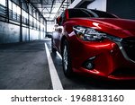 Red car body Object for service factory auto Car tail light red color 
 factory background for customers. Using wallpaper or background for transport or automotive automobile new car technology future