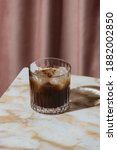 Small photo of Black Russian, a simple, two-part cocktail combining vodka and Kahlua, a coffee liqueur that’s made with rum, sugar and arabica coffee. It is less known than its successor, the White Russian