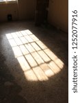 Small photo of Shadow of a large window from an English workhouse. Shadow of a large window of a dormitory from a Georgian workhouse in England.