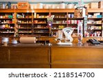 Small photo of L'Anse-a-Beaufils, Quebec, Canada, August 17, 2019 - Vintage counter, scale, canned goods, jars, and other objects in 1928 former Robin, Jones and Whitman general store