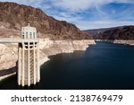 A Hoover Dam 395 feet high concrete and steel intake tower with the Colorado River and its surrounding area seen during a sunny day, Boulder City, Nevada, USA