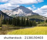 Small photo of Town of Banff, Bow River Trail scenery in summer sunny day. Banff National Park, Canadian Rockies, Alberta, Canada. Mount Rundle in the background.