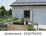Modern powerful heat pump in modern house using green energy, future of heating concept