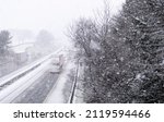 Small photo of Abington, UK - Friday 4th February 2022: Snow showers hit Scotland this morning as temperatures plummet due to a cold front sweeping across the UK. Motorists are pictured on the M74 near Abington