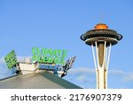 Small photo of Seattle - July 08, 2022; Two icons of the Seattle Center - the Space Needle viewing platform and Climate Pledge Arena sign on the top of the roof