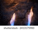 A fiery stream from a kerosene torch to snow and ice