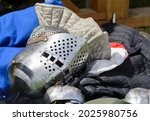 Small photo of Knight's helmet Bicok. Closed knight's helmet. Knight's helmet and knightly armor. Costumes of medieval knights