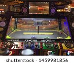 Small photo of Wisconsin, USA; July 2, 2019: A game allows players to remotely control “NASCAR” replica toy cars at the Tom Foolery arcade section of the Kalahari Resort in the Wisconsin Dells.