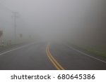 Empty foggy road and low visibility. Show misty and mystery background, fear and horror, Journey and adventure, Unexpected and obstacle in business concept, Safety driving on the road traffic concept.