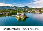 Small photo of Schloss Ort (or Schloss Orth) is an Austrian castle situated in the Traunsee lake, in Gmunden. Aerial drone view.