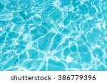 Ripple Water in swimming pool with sun reflection