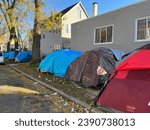 Small photo of CHICAGO - NOVEMBER 7, 2023: Migrant Tents Line a Street in a Residential Neighborhood on November 7 2023 in Chicago. Cold weather looms for migrants from Venezuela living in inadequate housing.