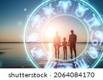 Small photo of The concept of the horoscope, circle with the signs of the zodiac on the background of the family, astrology. Consulting with the stars