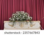 Small photo of coffin during the funeral ceremony put in the crematorium to be cremated according to religious ceremonies