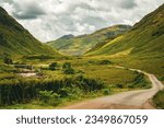 Small photo of Glen Etive (James Bond Sykfall Road) in Glencoe, Scotland in the Scottish Highlands - as seen through a car wing mirror
