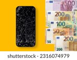 Black broken touch screen phone and euros banknotes