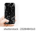 Black broken touch screen phone with cracked screen. Smashed glass