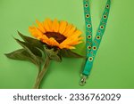 Sunflower lanyard, symbol of people with invisible or hidden disabilities.