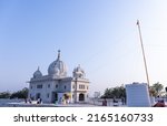 Small photo of Anandpur Sahib, Punjab, India - March 2022: Gurdwara Takht Sri Kesgarh Sahib in anandpur sahib, the birthplace of the khalsa sacred to the Sikh religion. White building architecture of sikhism.