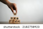 Small photo of GDP, symbol of gross domestic product Businessman holding a wooden block with an icon saying 'GDP' copy space. Business and GDP growth. Gross domestic product concept.